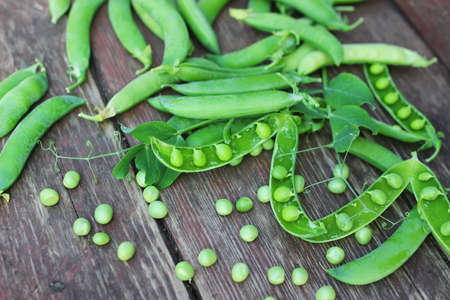 pea pod on the wooden backgroundの写真素材