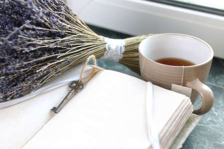 Vintage notebook on green marble windowsill opened with blank paの写真素材