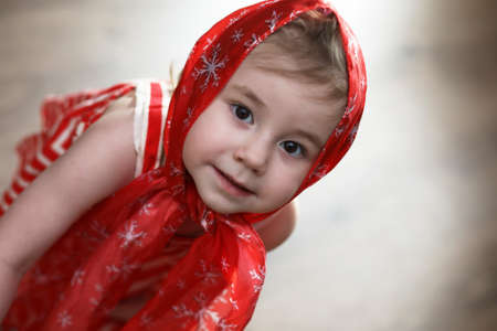 Little girl in dresses dancing with handkerchiefの写真素材