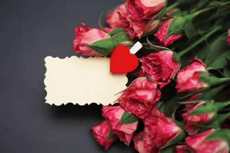 Bouquet of red roses on a black matte backgroundの写真素材