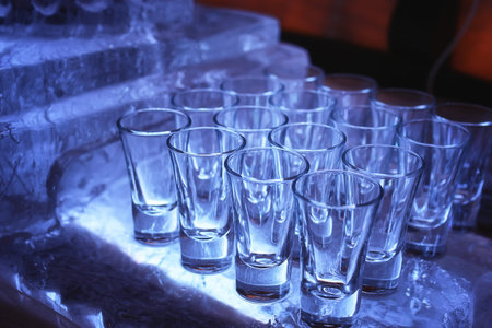 Glass wine glasses on the table served in the restaurantの写真素材