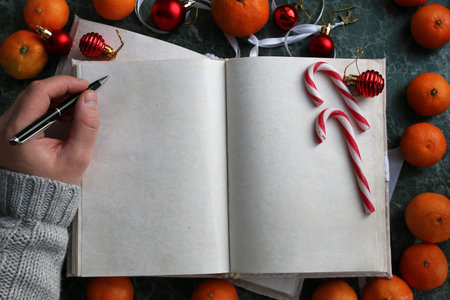pages opened vintage book on green marble countertop