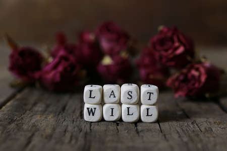 small wooden blocks with letters on them are laid in the floor on the old wooden tableの写真素材