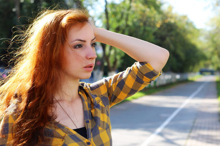 red-haired girl in a hat hipster