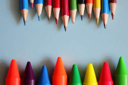 background for education concept scattered pencils and other stationeryの写真素材
