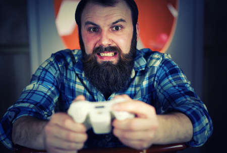 man bearded play joystickの写真素材