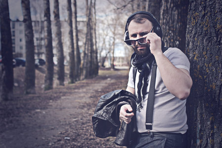 retro toned effected photo of alone man on streetの写真素材