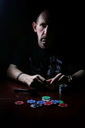 man smoke pipe and play pokerの写真素材