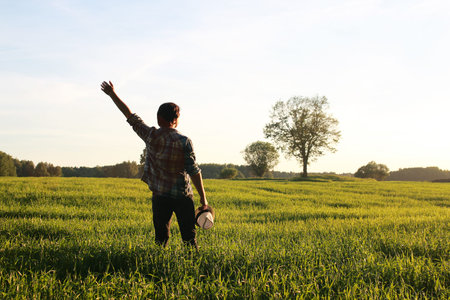 A man in casual clothes is a traveler in the open spaces
