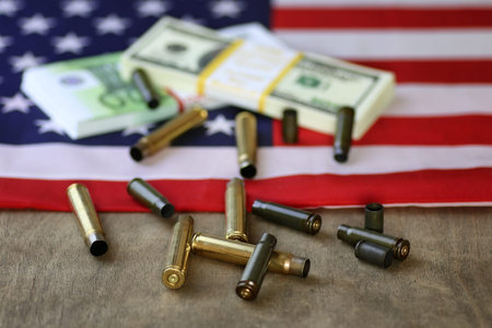 Bullet and money on the American flag