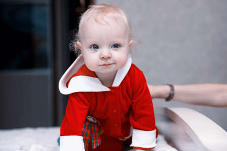 Portrait of a young blond child with blue eyesの写真素材