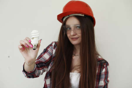 Girl doing repairs in the apartmentの写真素材