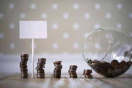 coins stacked in piles on the floorの写真素材