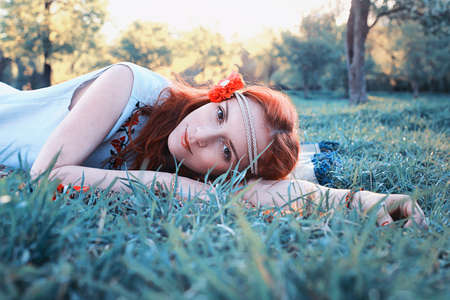 Girl on a spring sunny afternoon for a walk in the parkの写真素材