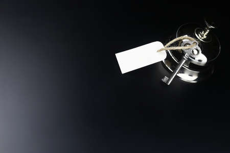 bell and the key at the reception in the hotelの写真素材