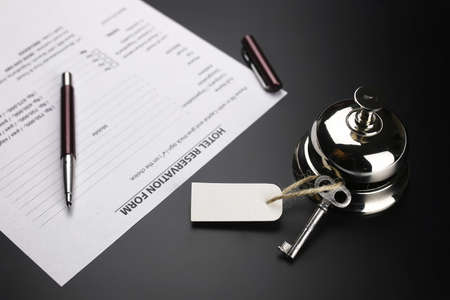 bell and the key at the reception in the hotelの写真素材
