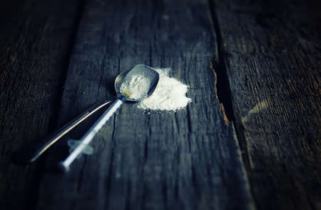 dirty wooden floor with drug syringe spoon cocainの写真素材