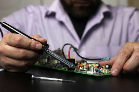 technology engineer of the modern world in a workflow with electronic devicesの写真素材