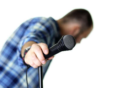 microphone on stage hand holdの写真素材