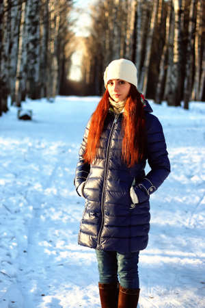 winter portrait female in forestの写真素材