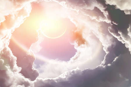 Planet light pierces through the clouds in the skyの写真素材