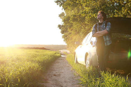 A man in casual clothes is a traveler in the open spacesの写真素材