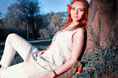 Girl in the spring walks through the apple alleyの写真素材