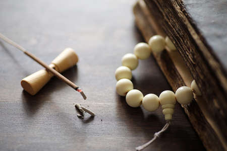 Different objects with traditional religious oriental on a wooden backgroundの写真素材