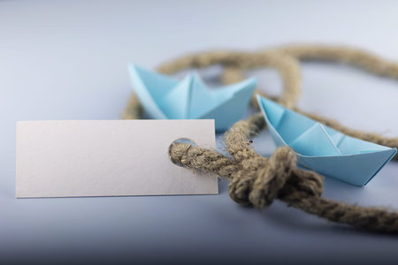 white sticker with thick braided rope and ship paper origamiの写真素材