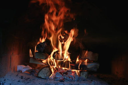 the texture of fire and flame tongues of fire in the furnace of a vintage red brick