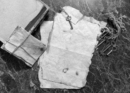 retro papers and book on detective work table with tools background