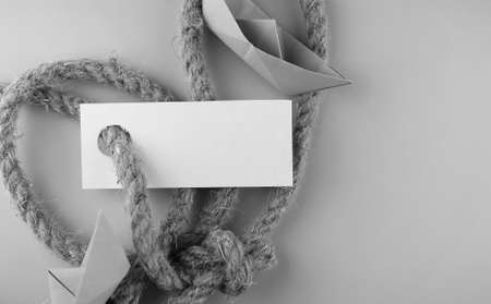 white sticker with thick braided rope and ship paper origamiの写真素材