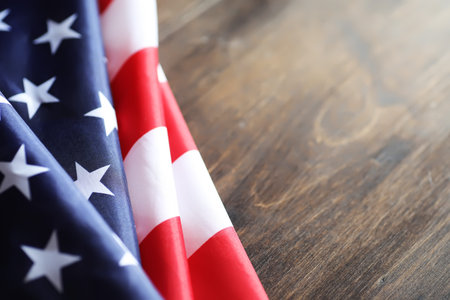 American flag on a wooden texture table and space for text