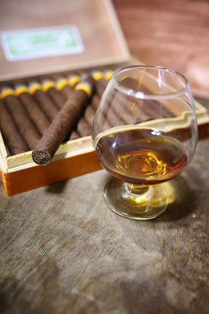 Large box of Cuban cigars on a wooden table in a presentable package