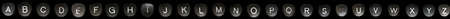 Full English alphabet on a key on a retro typewriter with a black backgroundの写真素材