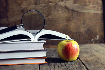 education book apple and magnifying glassの写真素材