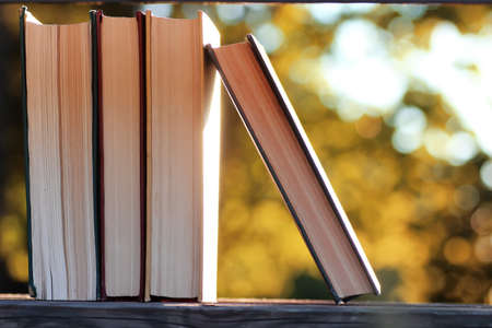 autumn book stack wooden outdoorの写真素材