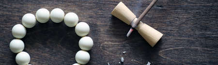 White beads and Incense on a wooden backgroundの写真素材