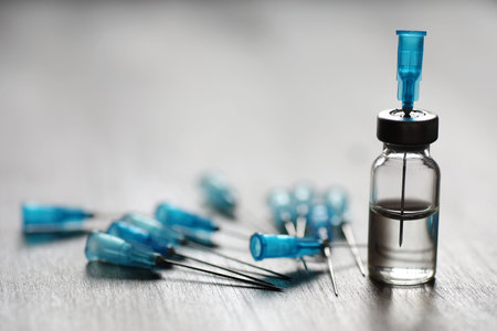 Ampoule and needles from a medical syringe