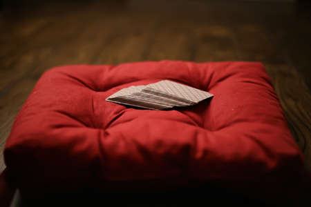 Pillows on a wooden parquet floorの写真素材