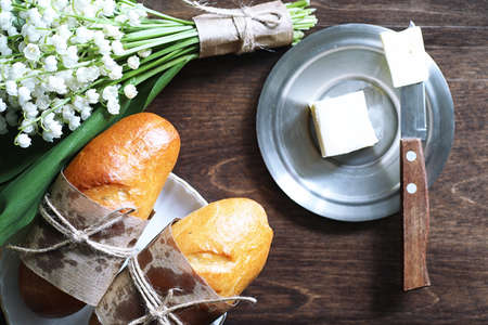 Freshly baked French baguette on a wooden tableの写真素材