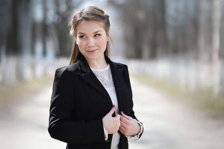 Girl in the city park for a walk casual clothesの写真素材