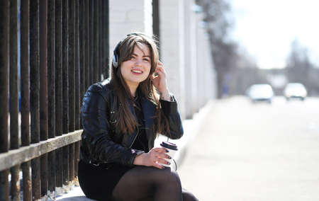 Girl in the city park for a walk casual clothesの写真素材