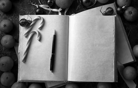 blank pages opened vintage book on green marble countertopの写真素材