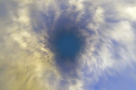 Sunlight pierces through the clouds in the sky