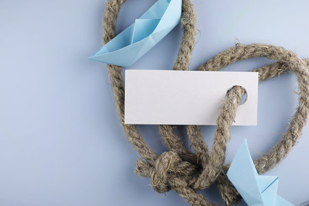 white sticker with thick braided rope and ship paper origamiの写真素材