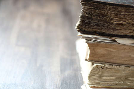 stack of old retro book on wooden brown tableの写真素材