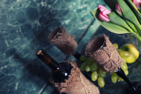 holiday set wine bottle with green grape on backgroundの写真素材