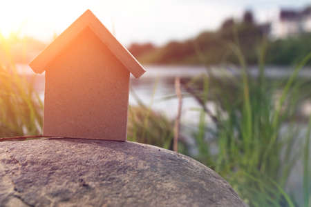 In the shape of a house a wooden figure in a coastal landscapeの写真素材