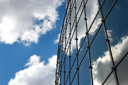 sky reflected in office buildingの写真素材